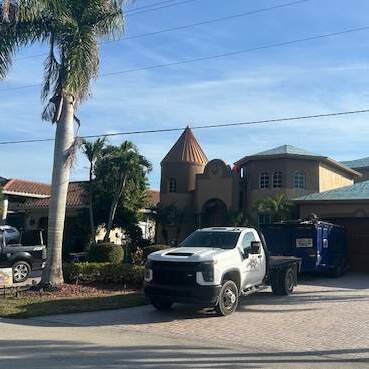 roofing truck beside a home